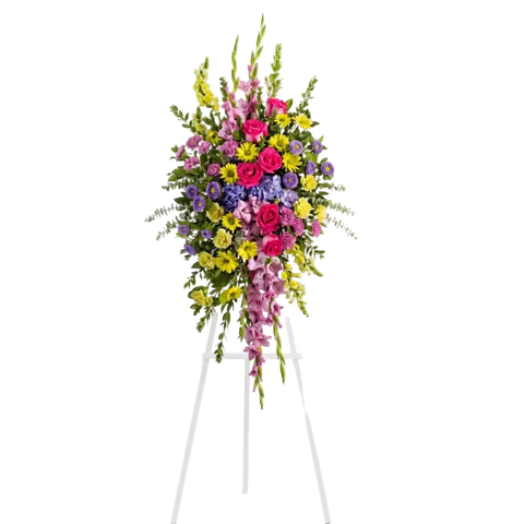Pedestal y Arreglo Fúnebre, Corona y Pedestal "Brillante y Hermoso". contiene: Flores vibrantes como hortensias y ásteres morados, crisantemos y gladiolos lavanda, además de rosas rosadas, claveles amarillos, boca de dragón y crisantemos. Flores 24 Horas, Bogotá, Colombia